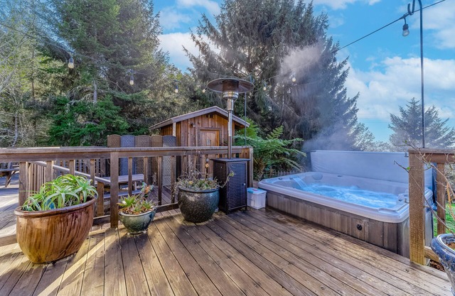 Charming home with game room, full kitchen, washer/dryer, & patio - dog-friendly