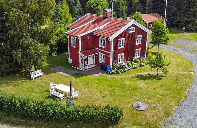 Charming old style house with quaint paintings from earlier times.