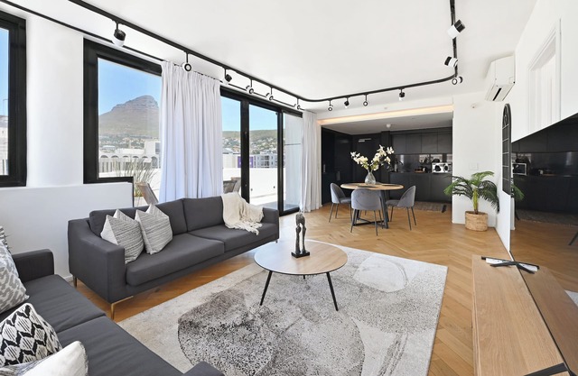 City Centre Rooftop Penthouse with 360° City & Mountain Views!