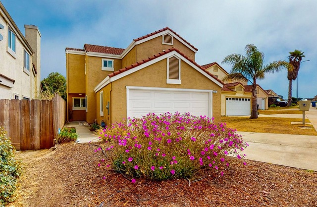 Coastal paradise with beautiful private yard - walk to beach