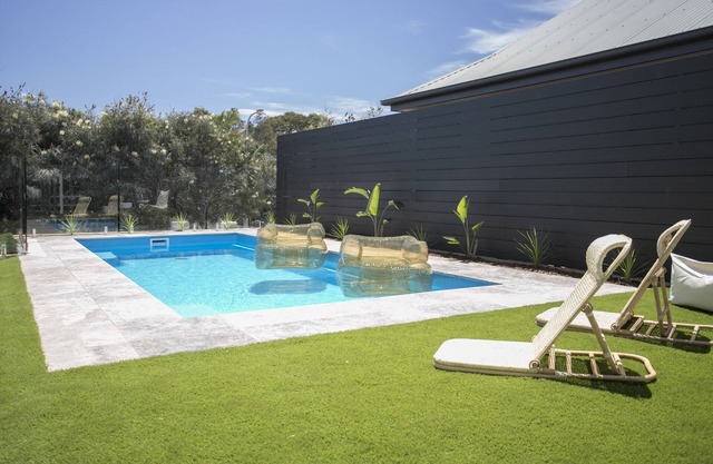 Coastal Vibe & Pool. Nestled halfway between the beach & shops.