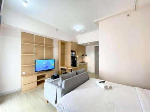 Comfort and Simply Design Studio at Vasanta Innopark Apartment By Travelio