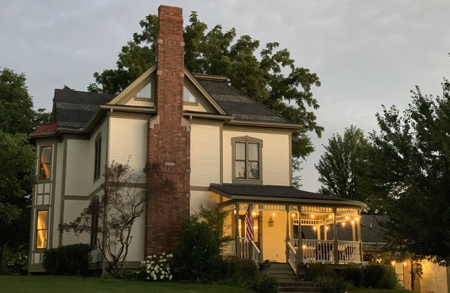 Completely restored 1885 Queen Ann style home located next to the temple lot.
