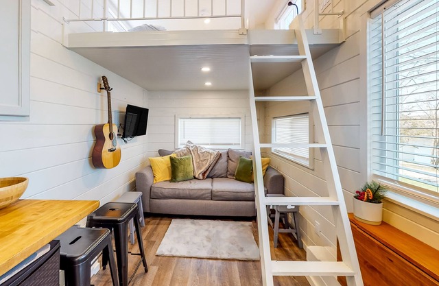 Contemporary tiny home with lake view, firepit, & gas grill