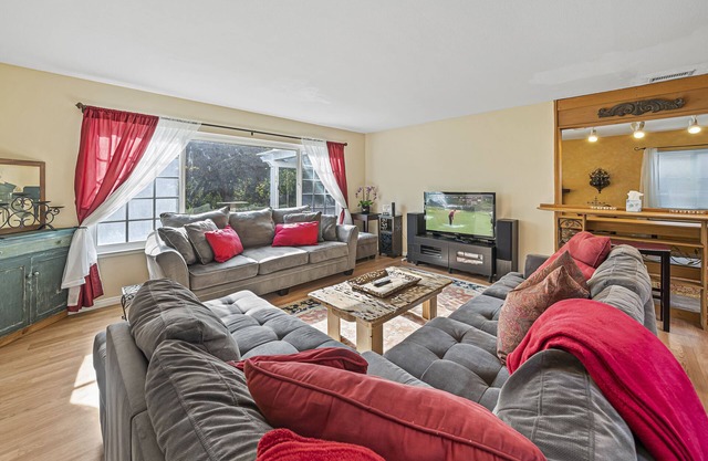 Costa mesa 4 bedroom home with Jacuzzi large yard next to a park.