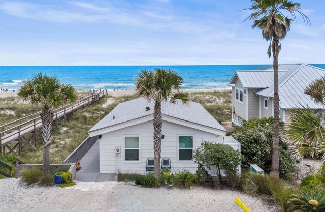 Cottage by the Sea features front row views of the beautiful beach and Atlantic Ocean.