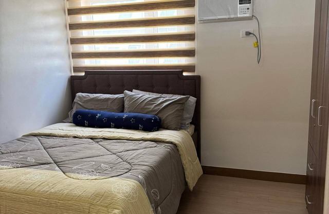 Cozy 1-bedroom condo with AC and WiFi in enjoyable Quezon City