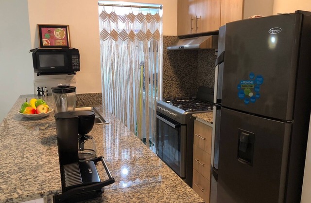 COZY AND GREAT Location at 1st Floor condo close to shopping center and beaches.