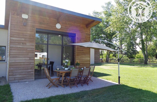 Cozy Chalets by the Pond with Terrace, Outdoor Activities, and Spa in Veauchette
