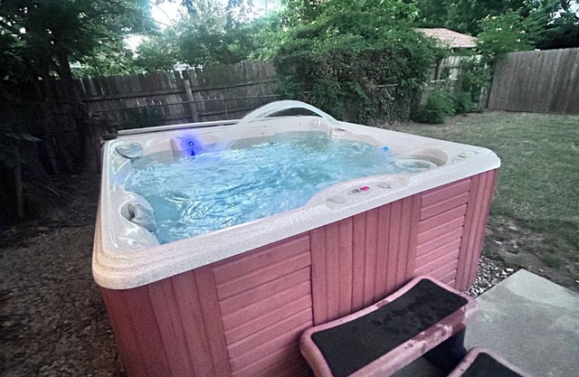 Cozy house in quiet neighborhood with hot tub, fire pit, and arcade games!