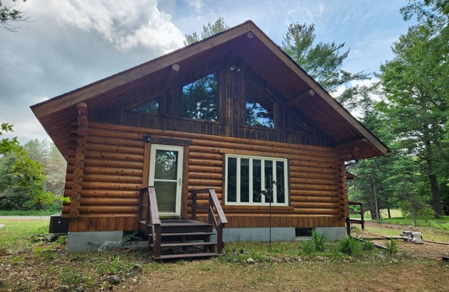cozy lake house, full log cabin on beautiful shell lake, w/wonderful loft.