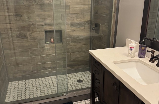 Cozy Ranch Style home with sun porch, above ground pool with fenced yard