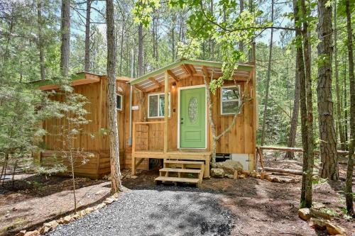Cozy Tiny Cabin with Porch & Fire Pit near Scenic Trails in Western Arkansas