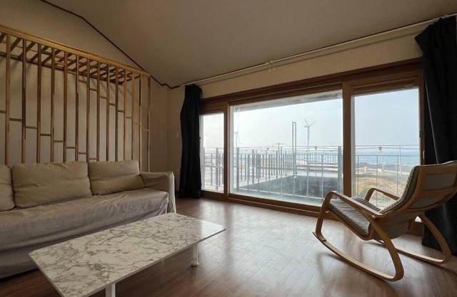 Detached house with the beautiful sunset and the sea.