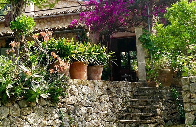 Detached natural stone house with a beautiful garden and small pool.