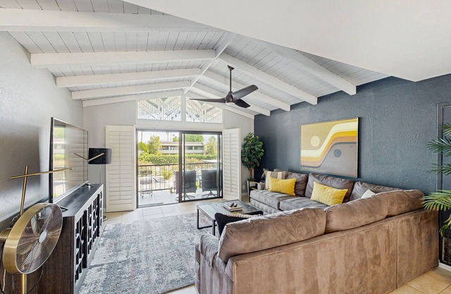 Dive into Palm Springs fun with a stylish home base featuring poolside lounging.