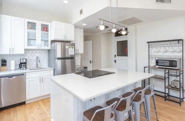 Downtown Digs-View of the City! Stay above local restaurants and nightlife, posh amenities heated toilet seat, oversized rain shower head in glass shower, in-unit laundry, one garage parking spot