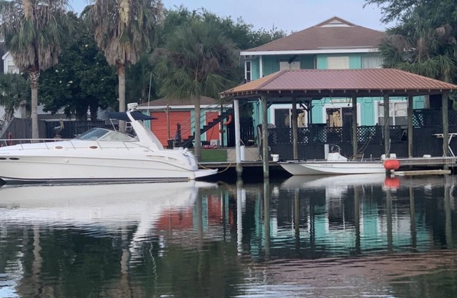 Enjoy this serene waterfront getaway with boat dock and deck.