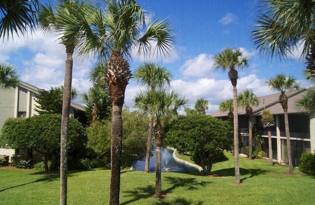 Enjoy your morning coffee on your covered lanai, then head over to beach only a brisk walk away!