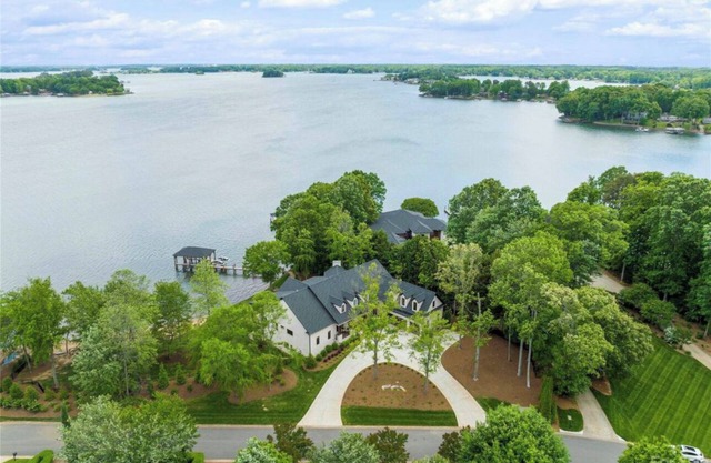 Exquisite New build on LN with over 295 ft of water frontage on a private street