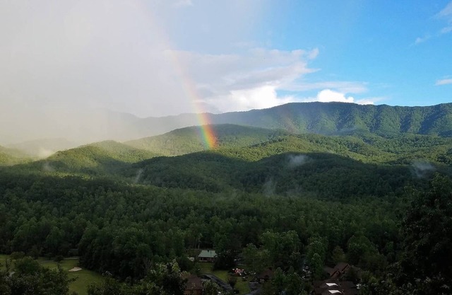 Fabulous views of the Smoky Mountains from enclosed porch and newly updated home