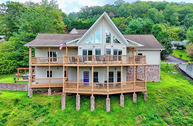 Fireside Vista by Chatuge Home Concierge Cozy mountain retreat with lake views, hot tub, game room, and private cinema lounge.