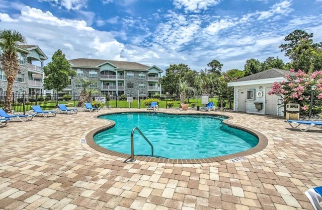 First Floor Updated Coastal Summer Retreat at Magnolia Place - Pool View
