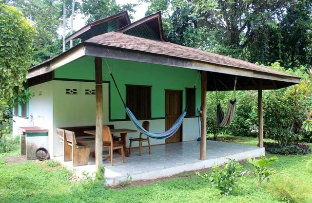 For 5 persons - 300 m from the beach in a tropical garden with biotope.