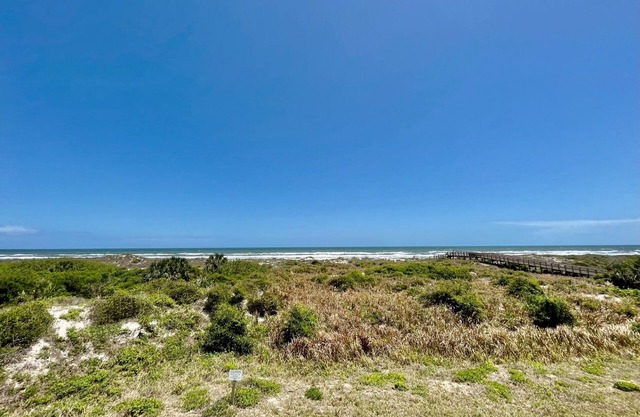 FREE FUN DAILY with this beautiful corner unit with substantial wrap around porch and marvelous views of the Atlantic Ocean!