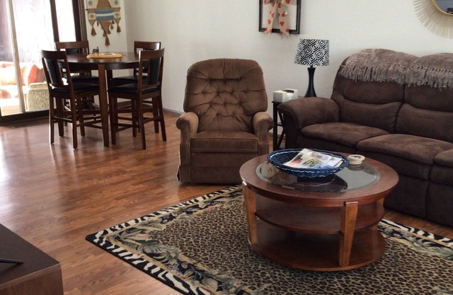 Fully furnished 3 bedroom ranch style home with large screened in porch w/garage