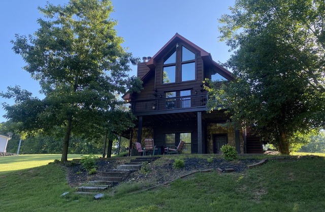 Gorgeous large waterfront log lake home with private dock!