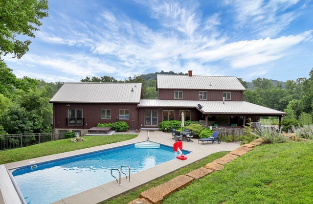 Hillside haven on expansive grounds, heated pool, firepit, bocce court and more!