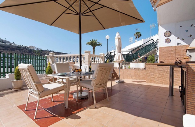 Holiday Apartment "Jolly Suite Puertorico Beach" with Shared Pool, 2 Private Terraces & Wi-Fi