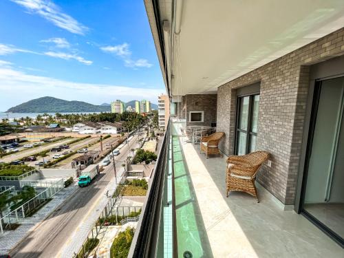 Home 48 I Apto pé na areia e com Piscina Aquecida em Bertioga