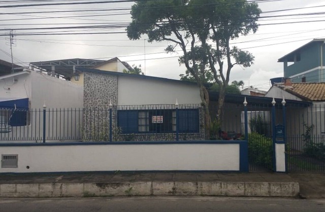 home Beach Center, wooded and grassy yard with fruit trees.