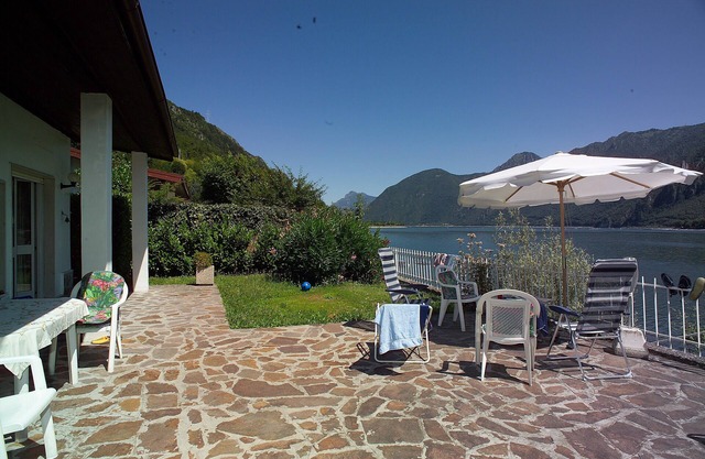 House by the lake with garden