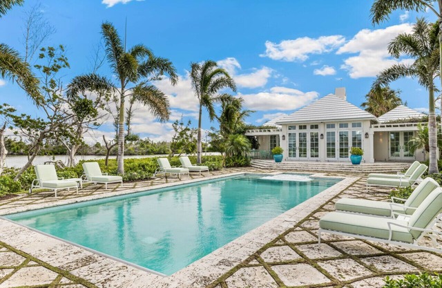 Immerse Yourself in Luxury! Stunning 6 Bedroom Home w/Pool & Dock