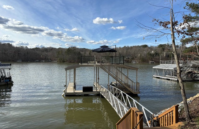 Lake house & 2-story dock. Enjoy sunsets, fishing, & relaxing with friends.