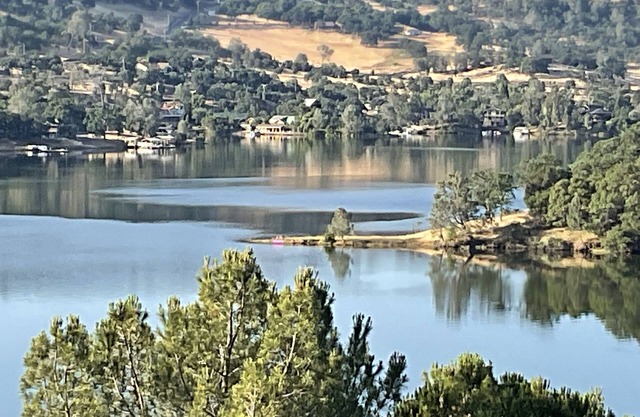 Lake house with fabulous views, game room, decking and hot tub.