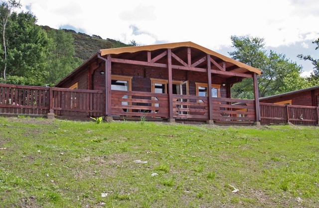 Lake side log cabin peacefully situated and each enjoying fabulous lake views.