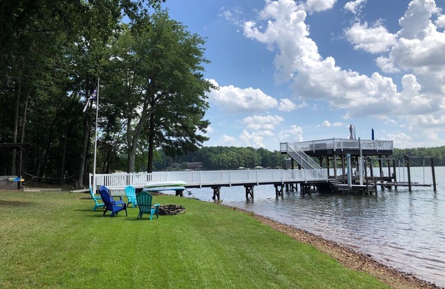 Lakefront, sunsets, dock slide and more at Heron House!