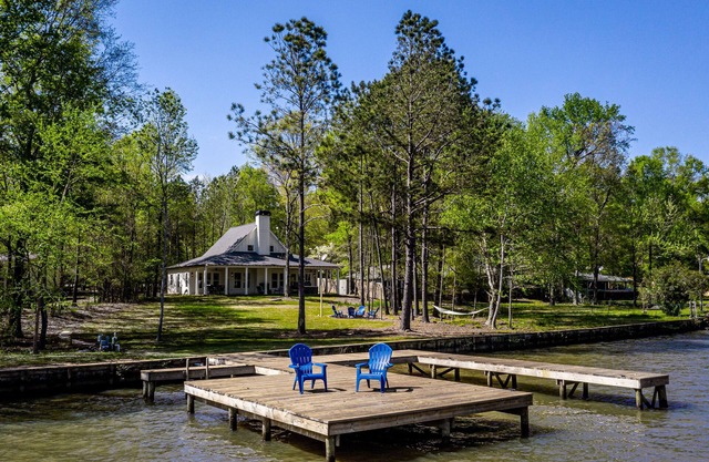 Luxe, lakefront home with private hot tub, dock, kayaks & firepit - dog-friendly