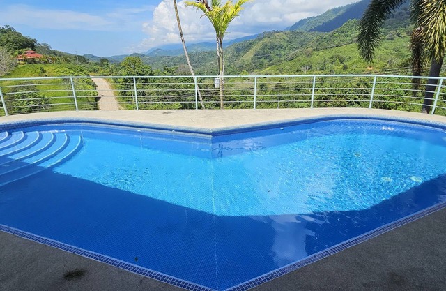 Luxury Mountain Home with Ocean and Rain Forest Views. Newly tiled pool!