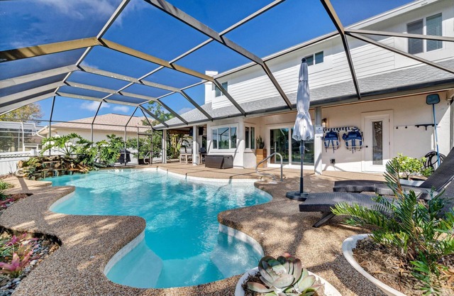 Luxury Pool Home | Boat Dock | Canal Home | Recently Updated | Close to Golf | WIFI | Heated Pool