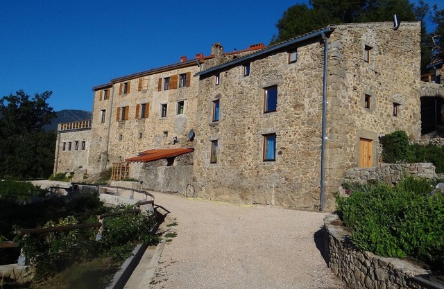 Mas Vilalte, an old mansion house immersed in the woody slopes of Mount Canigo
