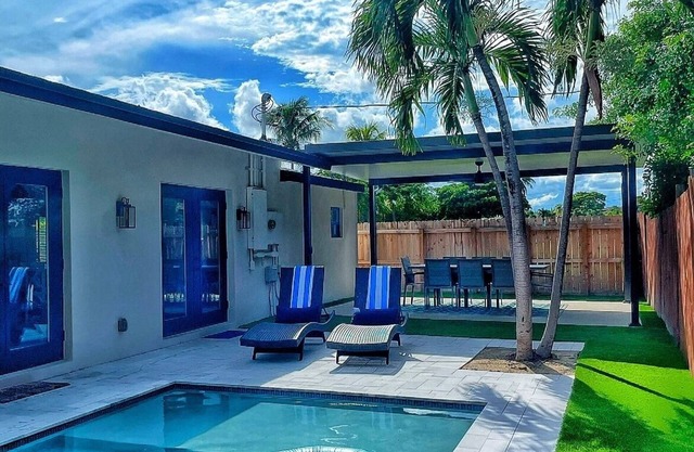 Modern heated pool home, family friendly. 3 minute walk to the beach!