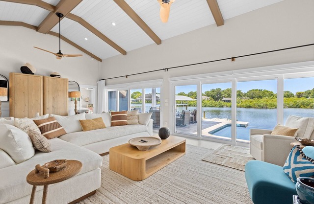 Modern indulgence with media room, expansive waterway views, AC, WD and Wifi