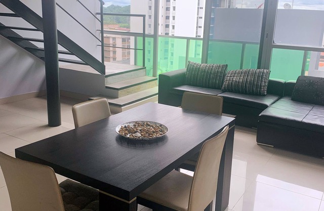 Modern loft-style, 2 level apartment with city views, cover parking and pool.