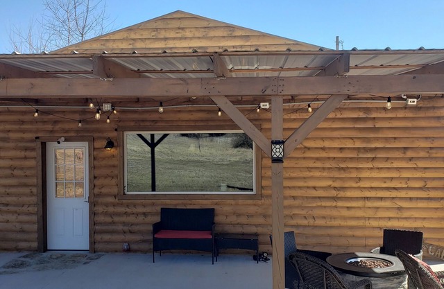 Modern Log Cabin with indoor and outdoor jacuzzi tubs