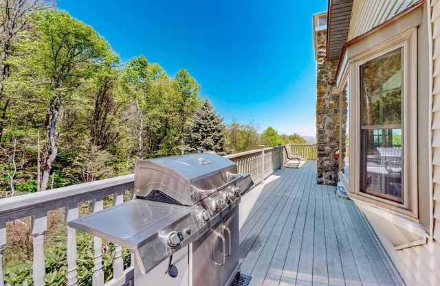 Mountain view home with a furnished deck, gas fireplace, & washer/dryer